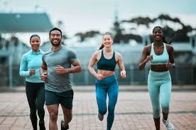 Sculpting Sleek Arms: The Essential Role of Cardio in Toning Without Bulking Up 3 image of people running to incorporate cardio Rotherham exercise into their life to help tone arms and body.