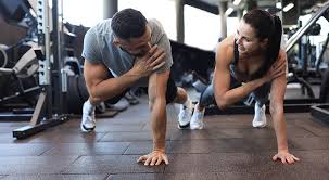 Sculpting Sleek Arms: The Essential Role of Cardio in Toning Without Bulking Up 1 Image of man and woman doing Cardio Rotherham to tone their arms.